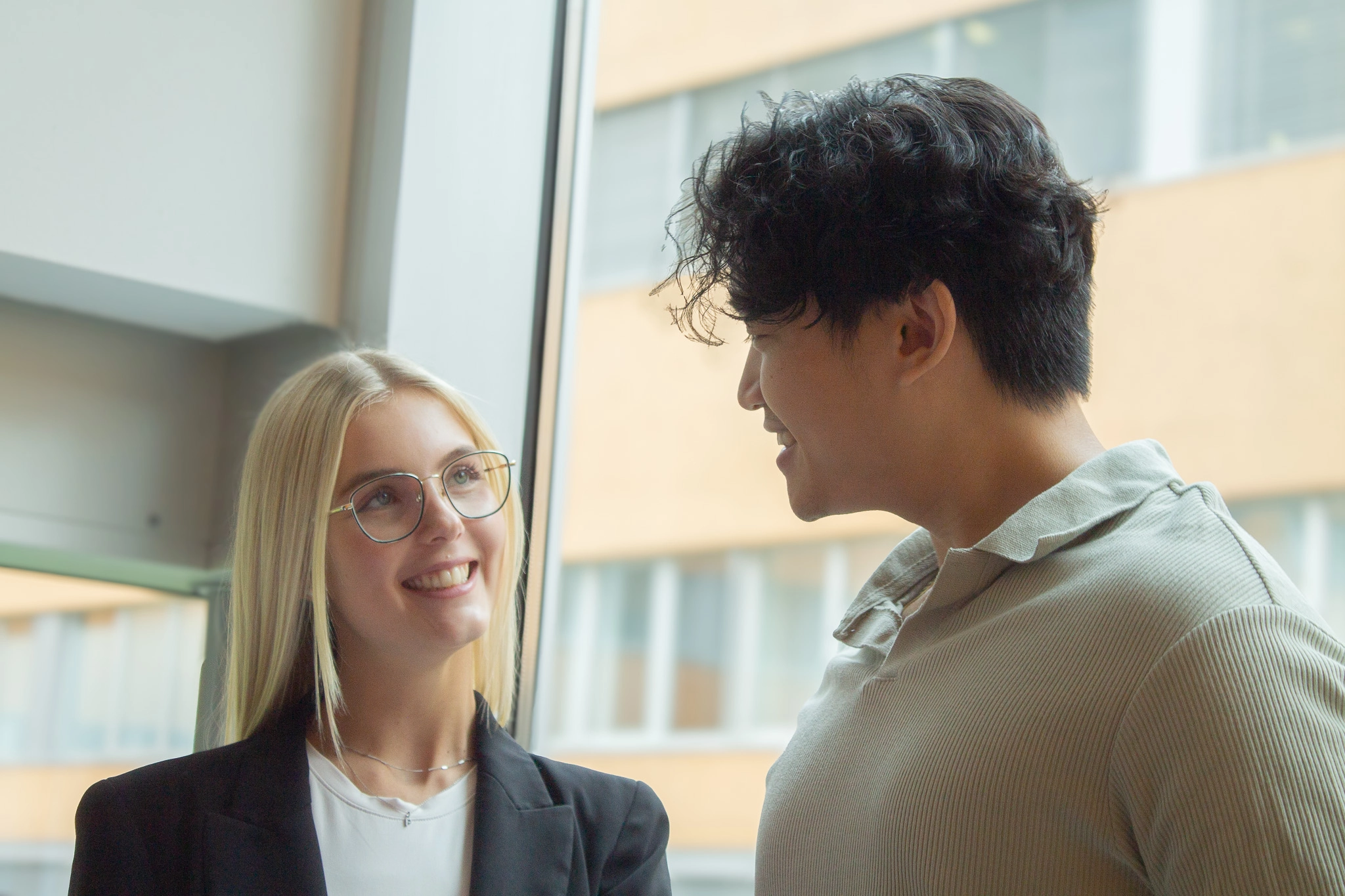 Two team members talking in the office